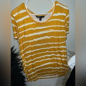 Women’s tee shirt. Mustard and white horizontal wave stripes.